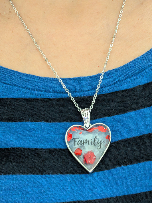 This stunning necklace features a 21-inch stainless steel cable link chain adorned with a beautiful family resin and flowers silver heart pendant. The perfect length for any outfit, with the option to add an additional 2 inches for the perfect fit. Show your love and style with this unique piece!
Necklace - 21 inches stainless steel cable link chain with a family resin and flowers silver heart pendant