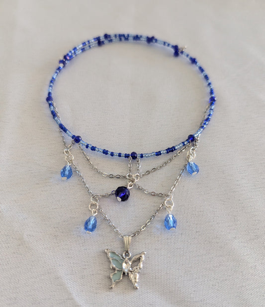Capture the magic of transformation with this enchanting butterfly memory wire choker. Delicate seed and crystal beads frame a stunning silver butterfly charm that becomes the focal point of this graceful design. The hassle-free memory wire construction fits perfectly every time—no clasps required—while the featherlight 0.38 oz weight makes it ideal for layering or wearing solo.