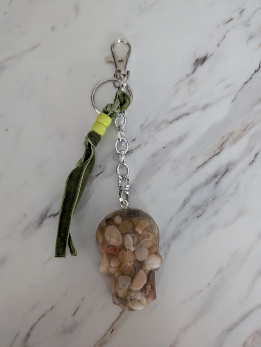 Keychain with natural stone design on a marble surface