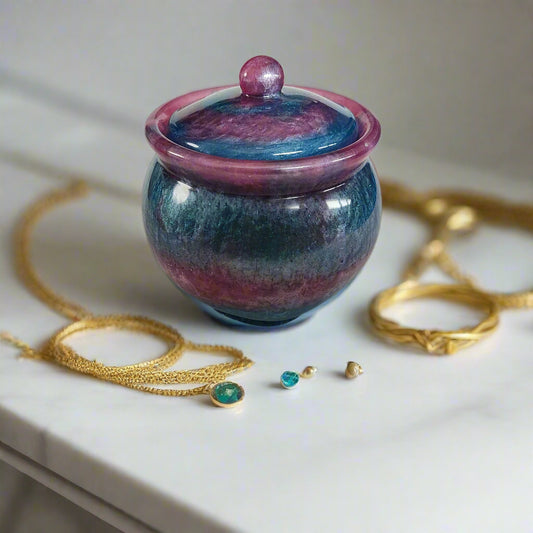 Store your treasures in this quirky Knickknack resin jar with lid. With a convenient size of 2.75 x 2.75 inches and a weight of 7.9 ounces, it's the perfect addition to your home decor. The 3.5-inch height and 2-inch depth make it both functional and stylish. Keep your items safe in style!
Resin Jar with lid
hand crafted with epoxy resin.
