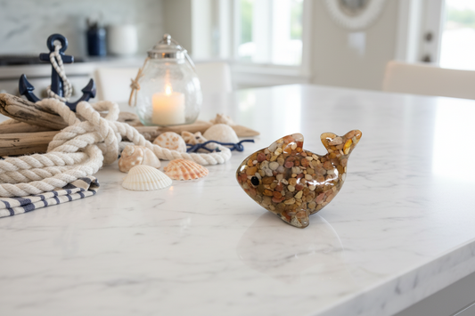 "Add a touch of whimsy to your space with our Knickknack - Resin dolphin. Handcrafted from durable resin, this charming dolphin figurine will bring a sense of playful wonder to any room. Its intricate design and intricate details make it a unique and eye-catching addition to your home decor. Perfect for ocean lovers or those looking to add a touch of nautical charm. Bring this adorable dolphin home today!"