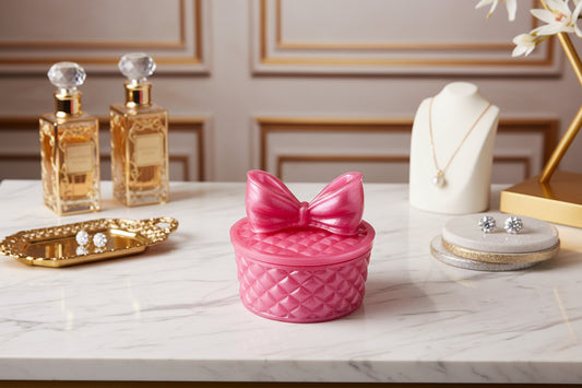 This beautifully crafted resin round trinket box with a bow lid is perfect for storing your delicate items. The intricate design adds a touch of elegance and sophistication to any room. Keep your trinkets safe and organized in this stylish and functional piece.