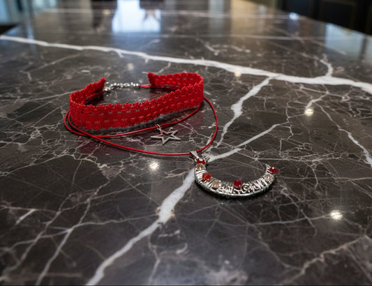 Transform any outfit into a stellar ensemble with this playful Necklace-Choker! Featuring an elastic lace ribbon, two polyester strands, and a crystal-studded silver moon and star charm, this necklace adds a touch of whimsy to your look. Plus, with a 2 inch extension chain, it's perfect for any neckline.