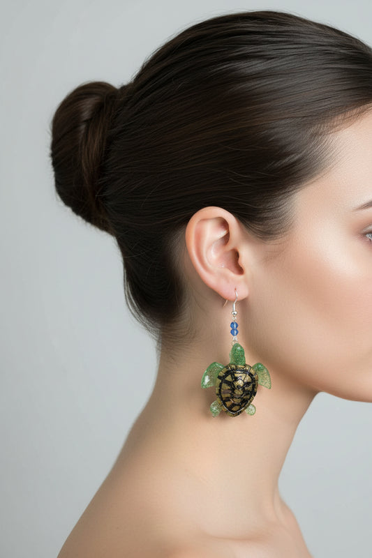 Add a touch of whimsy to your everyday look with our Earrings - Resin turtle on hook. These lightweight earrings feature a charming resin turtle design and a comfortable hook closure, perfect for any occasion. With a length of 2.5 inches and weighing only 0.36 ounces, they're both playful and practical.