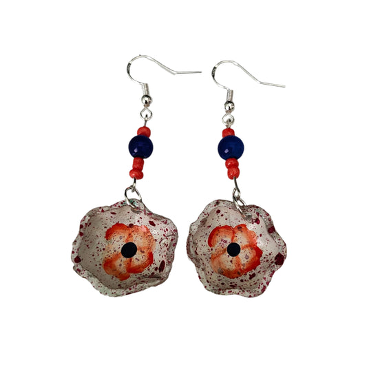 Add a taste of Mexico to your wardrobe with our Earrings! Unique ceramic plates adorned with crystal and seed beads dangle from sleek silver hooks. At 2.5 inches long and weighing only 0.13 oz, these earrings are a lightweight and stylish addition to any outfit.