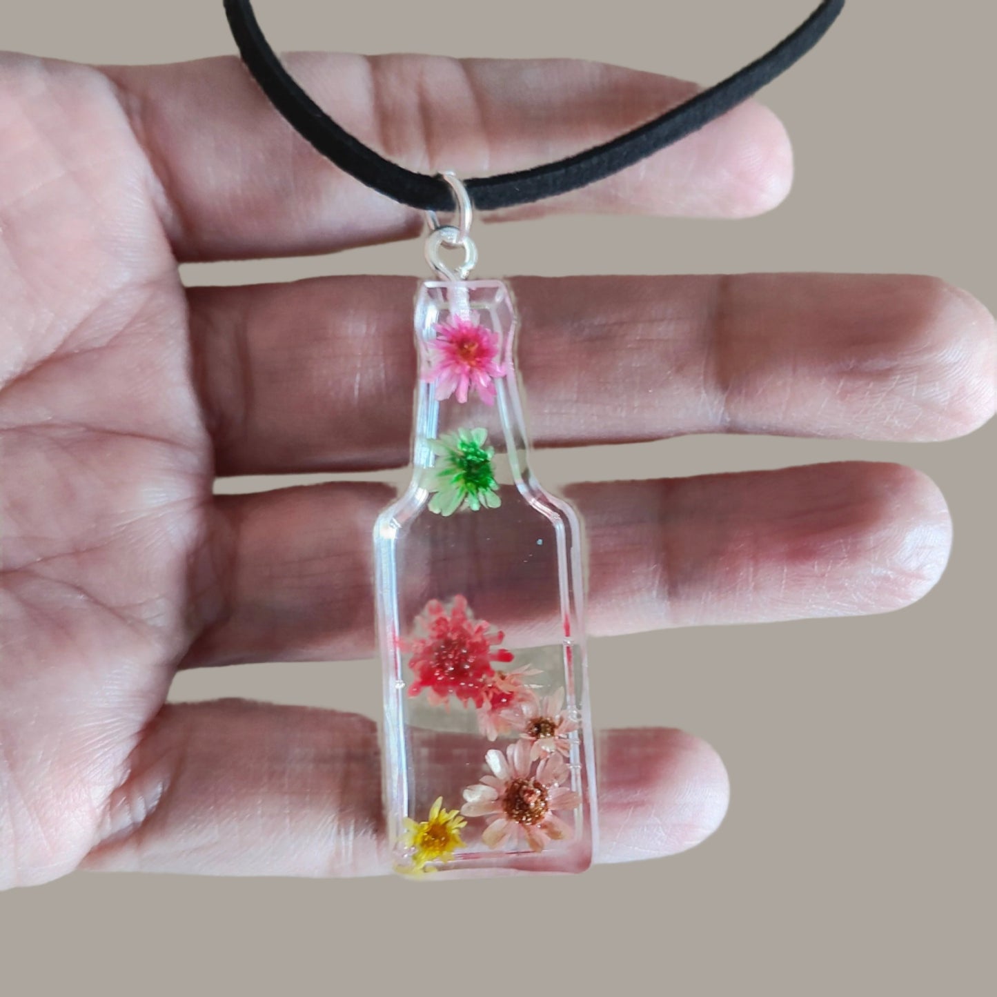 Necklace - 15.5 inches black suede cord with flowers resin bottle pendant