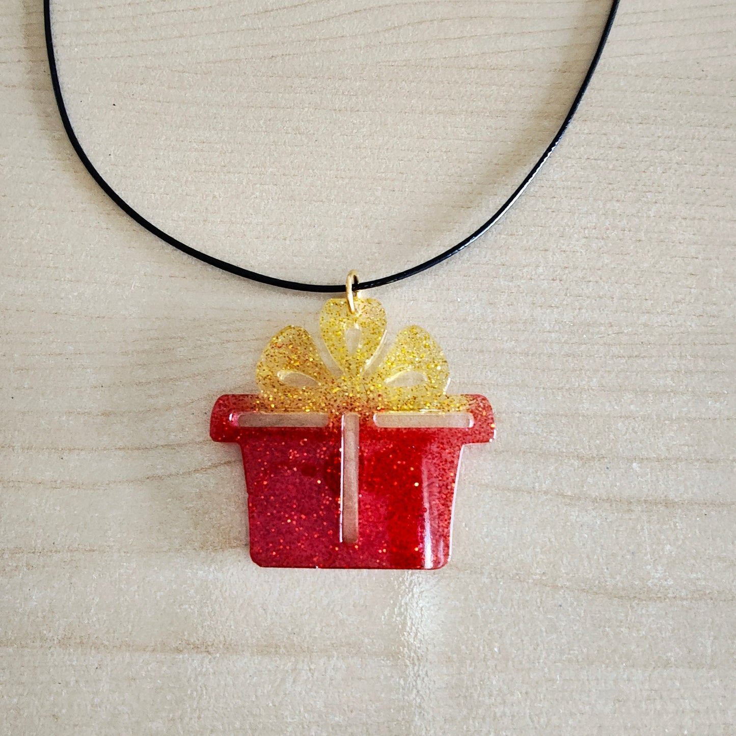 Necklace - 19 inches 0.5 mm black polyester cord with resin holiday pendant