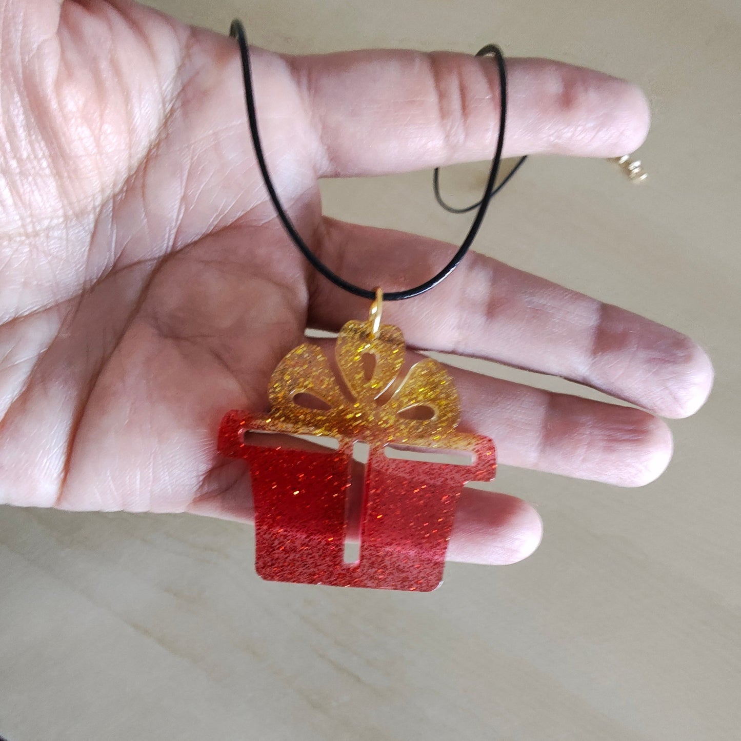 Necklace - 19 inches 0.5 mm black polyester cord with resin holiday pendant