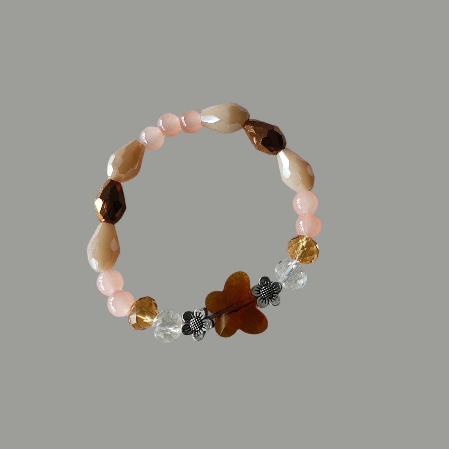 Bracelet - Elastic Crystal butterfly bead with brown, white, & pink beads and flower metal spacer beads
