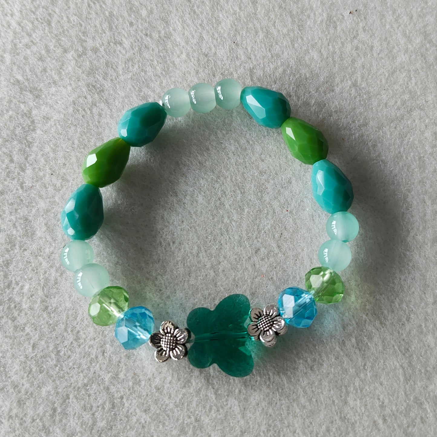 Bracelet - Elastic Crystal butterfly bead with blue and green beads and flower metal spacer beads