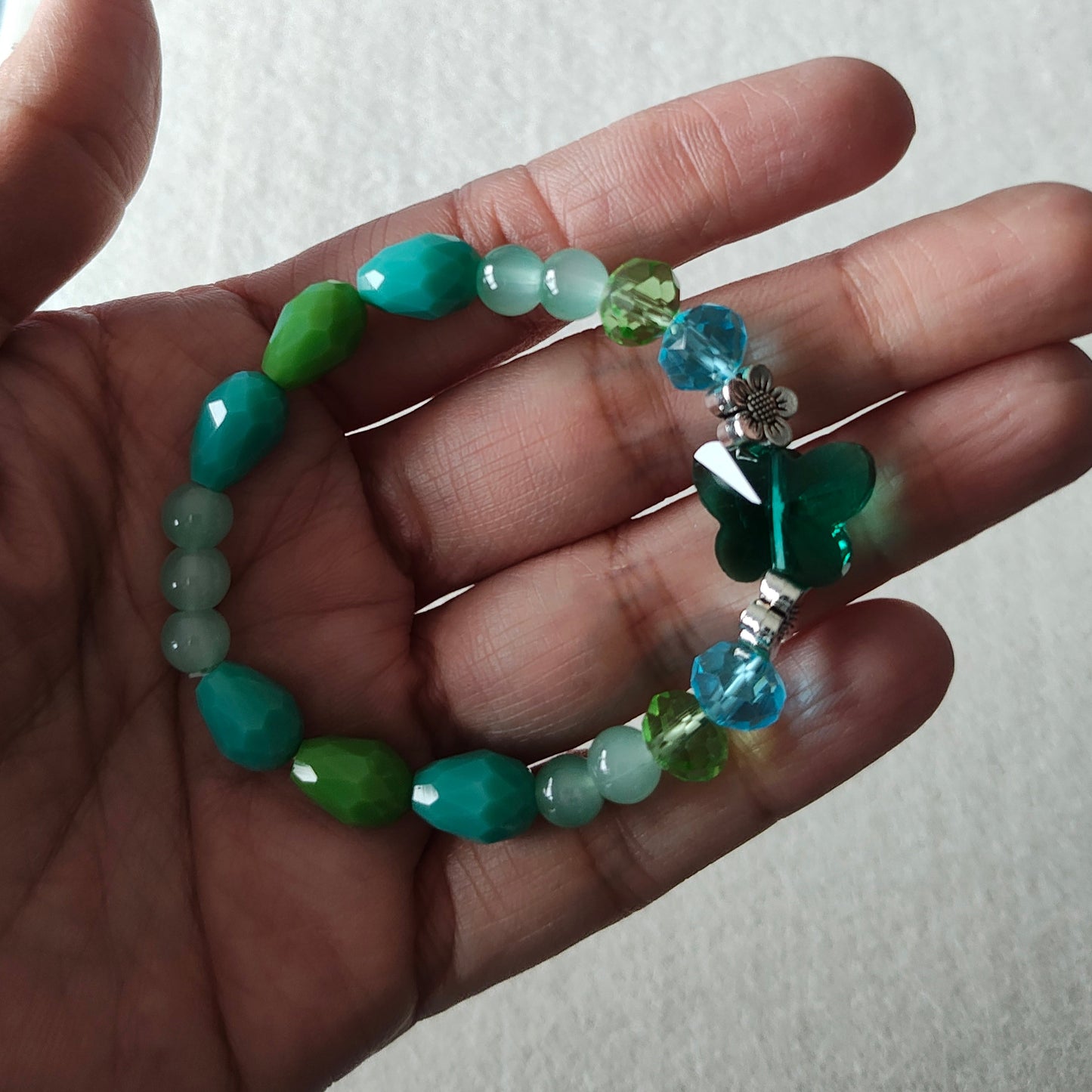 Bracelet - Elastic Crystal butterfly bead with blue and green beads and flower metal spacer beads