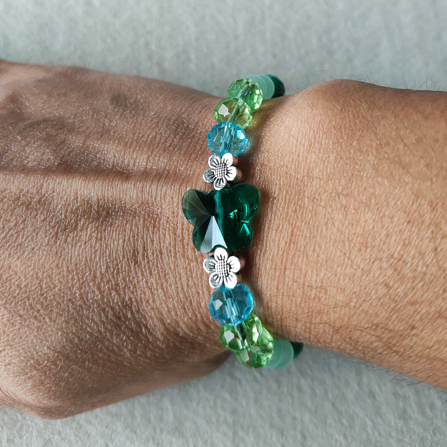 Bracelet - Elastic Crystal butterfly bead with blue and green beads and flower metal spacer beads