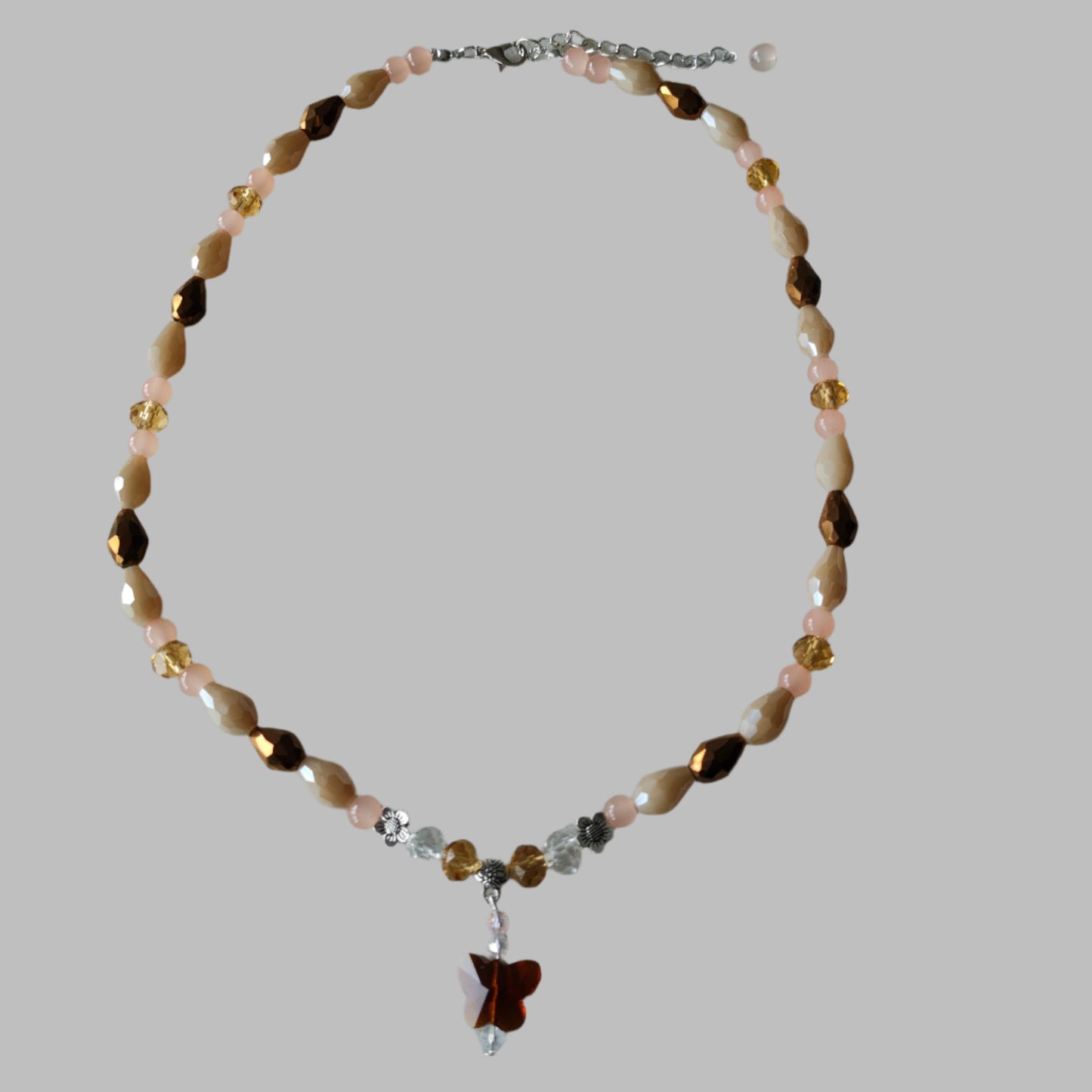 Necklace - 19.5 inches with crystal butterfly and glass beads and metal flower beads
