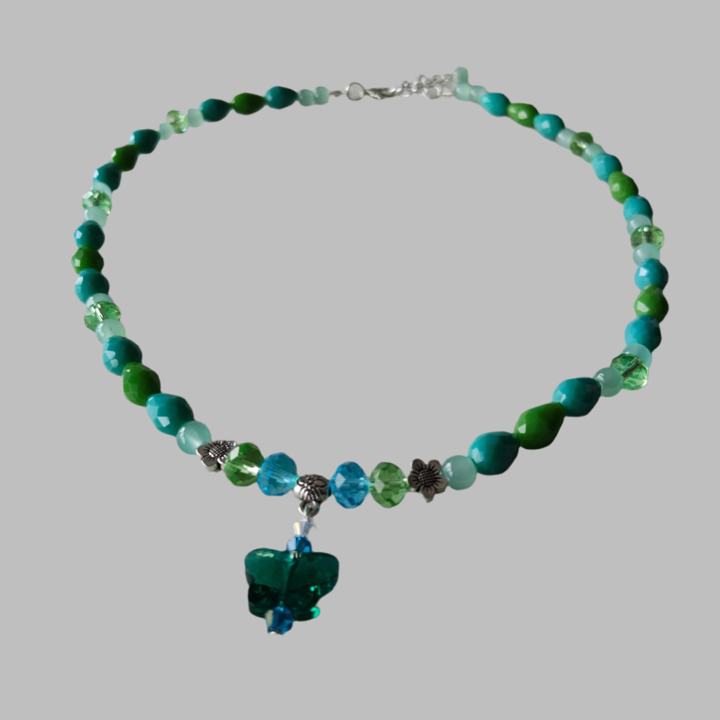 Necklace - 19.5 inches with crystal butterfly and glass beads and metal flower beads