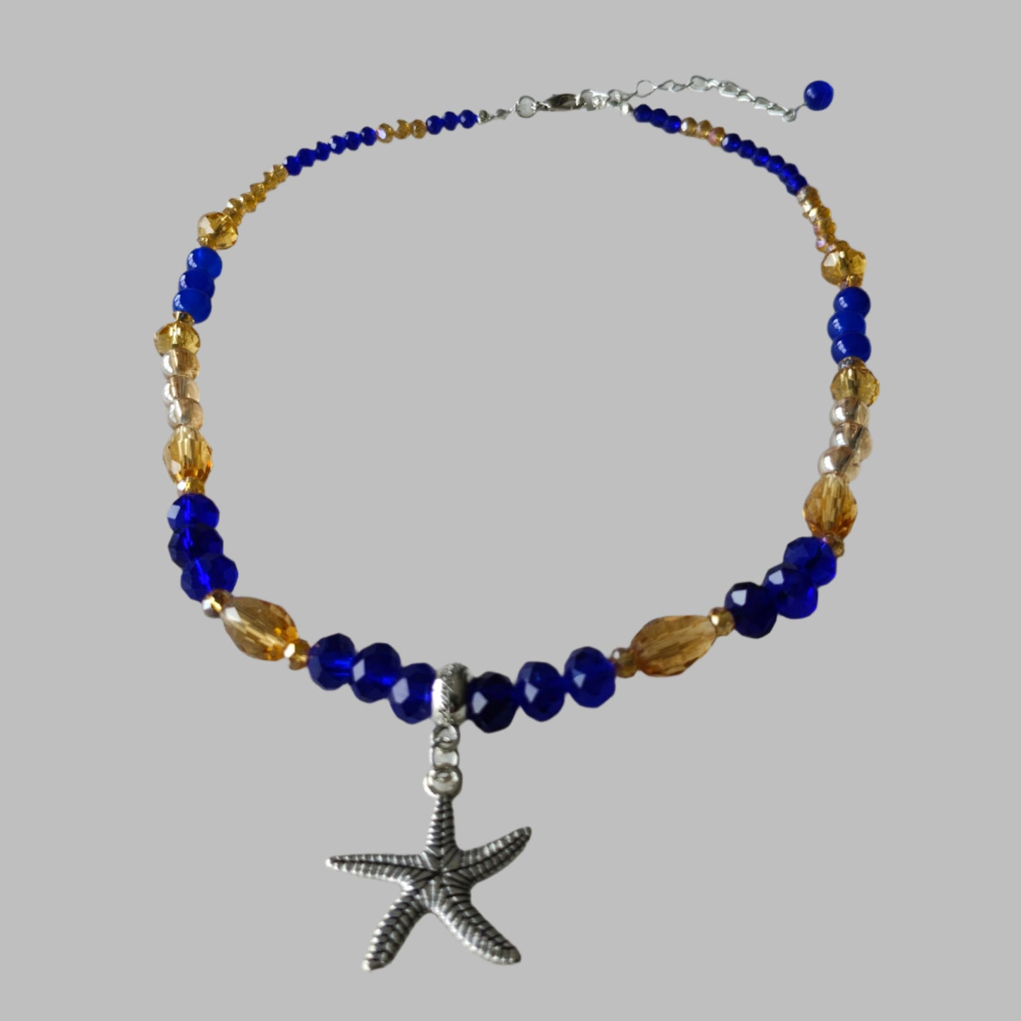 Necklace - Silver starfish charm with blue and gold crystal and glass beads