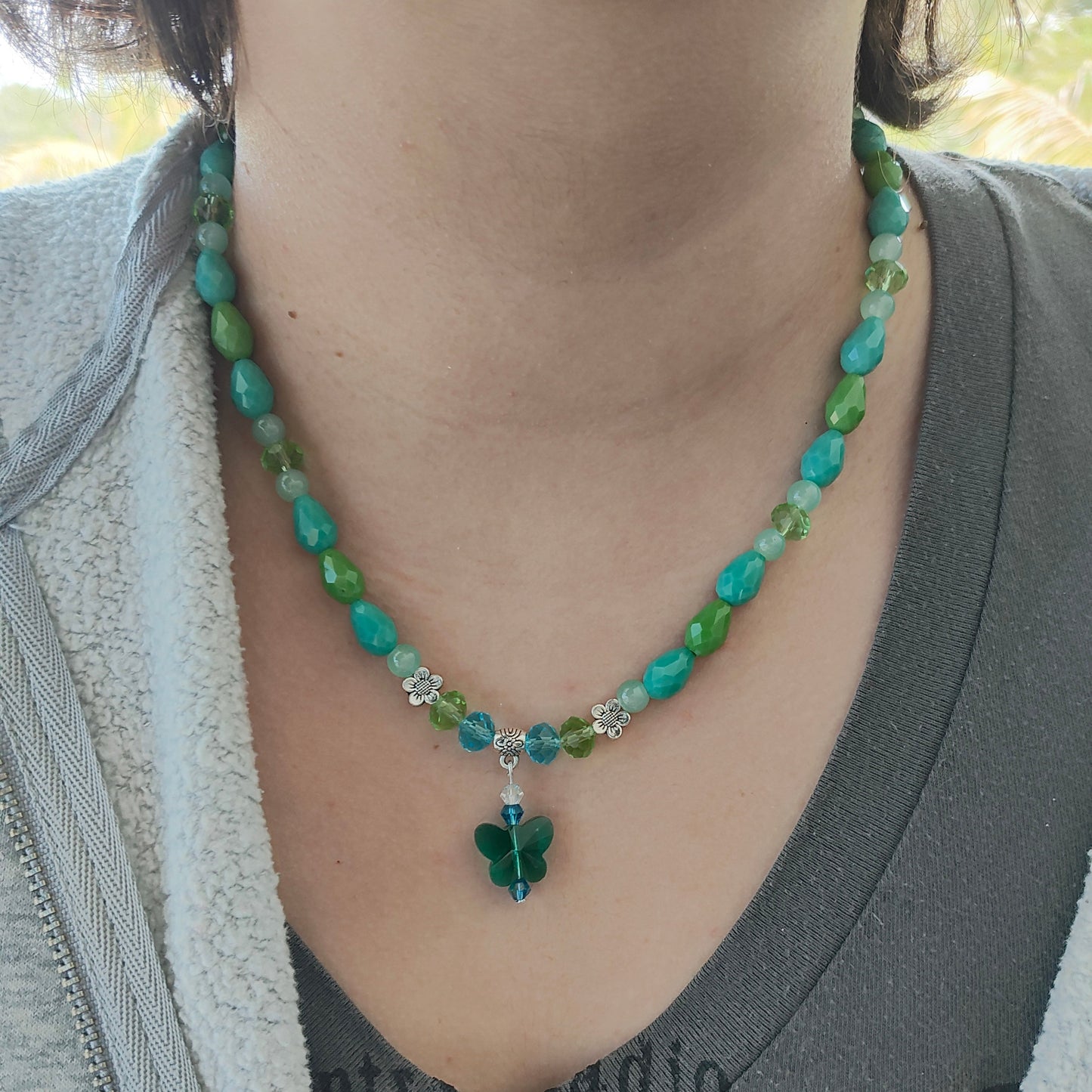 Necklace - 19.5 inches with crystal butterfly and glass beads and metal flower beads