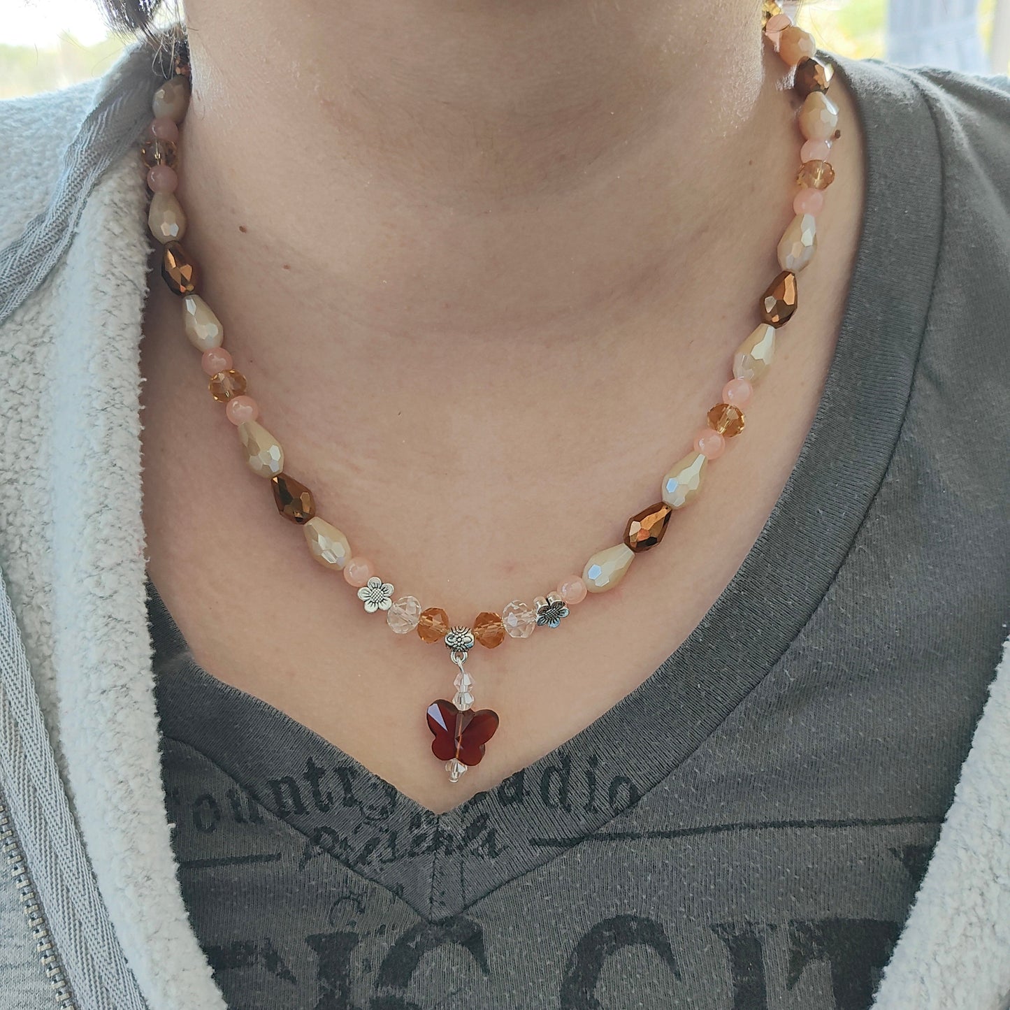 Necklace - 19.5 inches with crystal butterfly and glass beads and metal flower beads