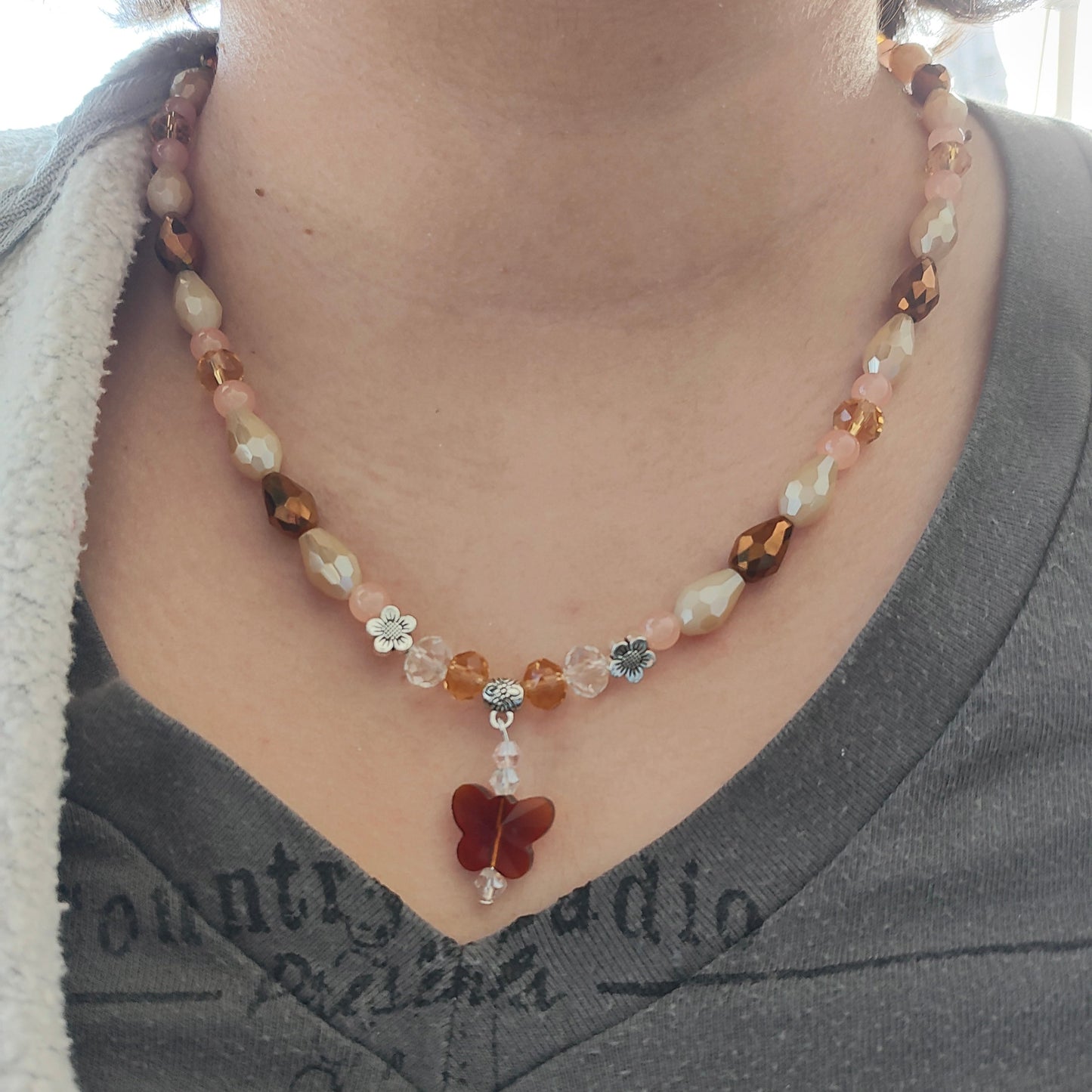 Necklace - 19.5 inches with crystal butterfly and glass beads and metal flower beads