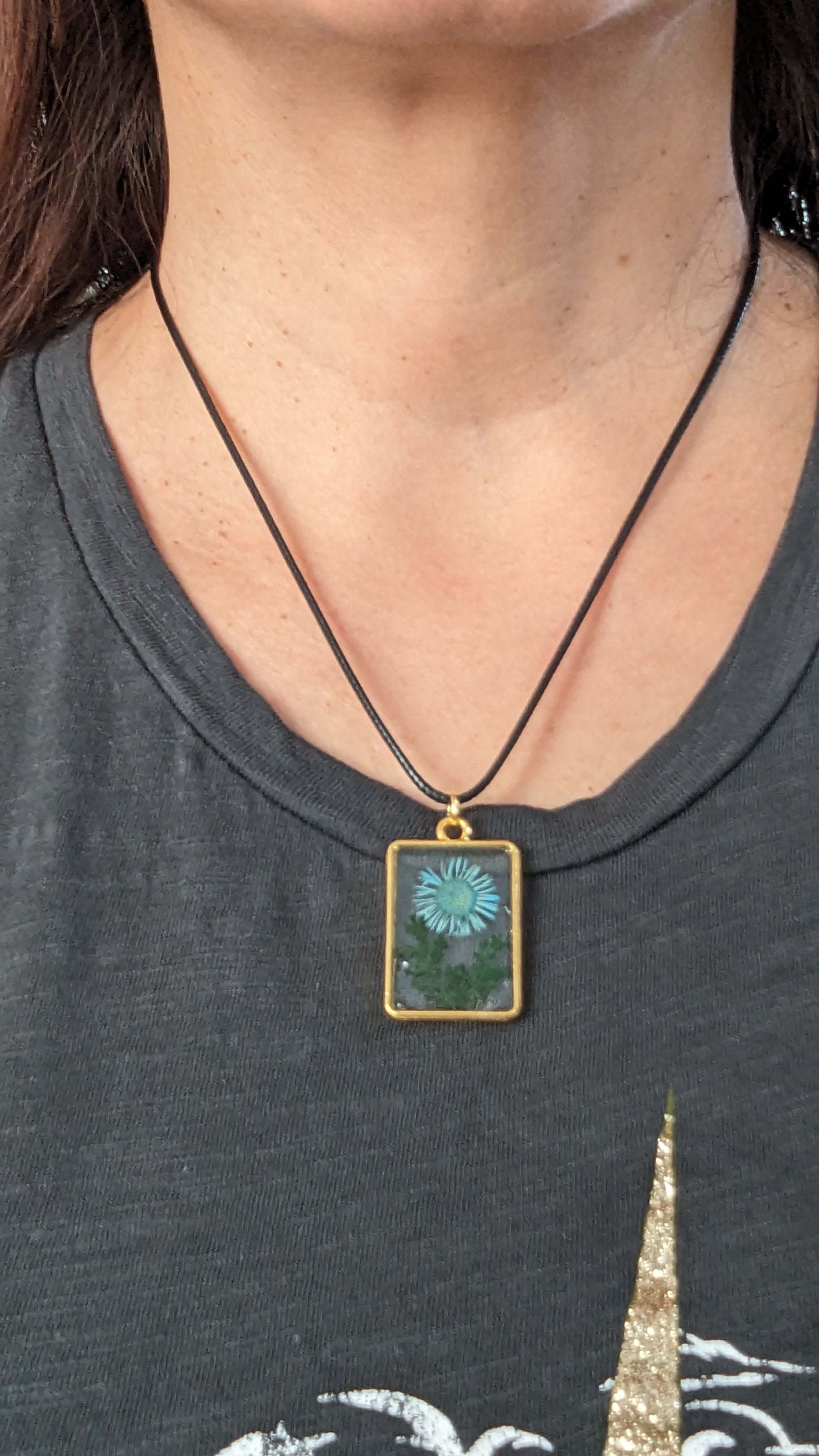 Necklace - 17.5 inches resin and flowers gold rectangle pendant on black cord