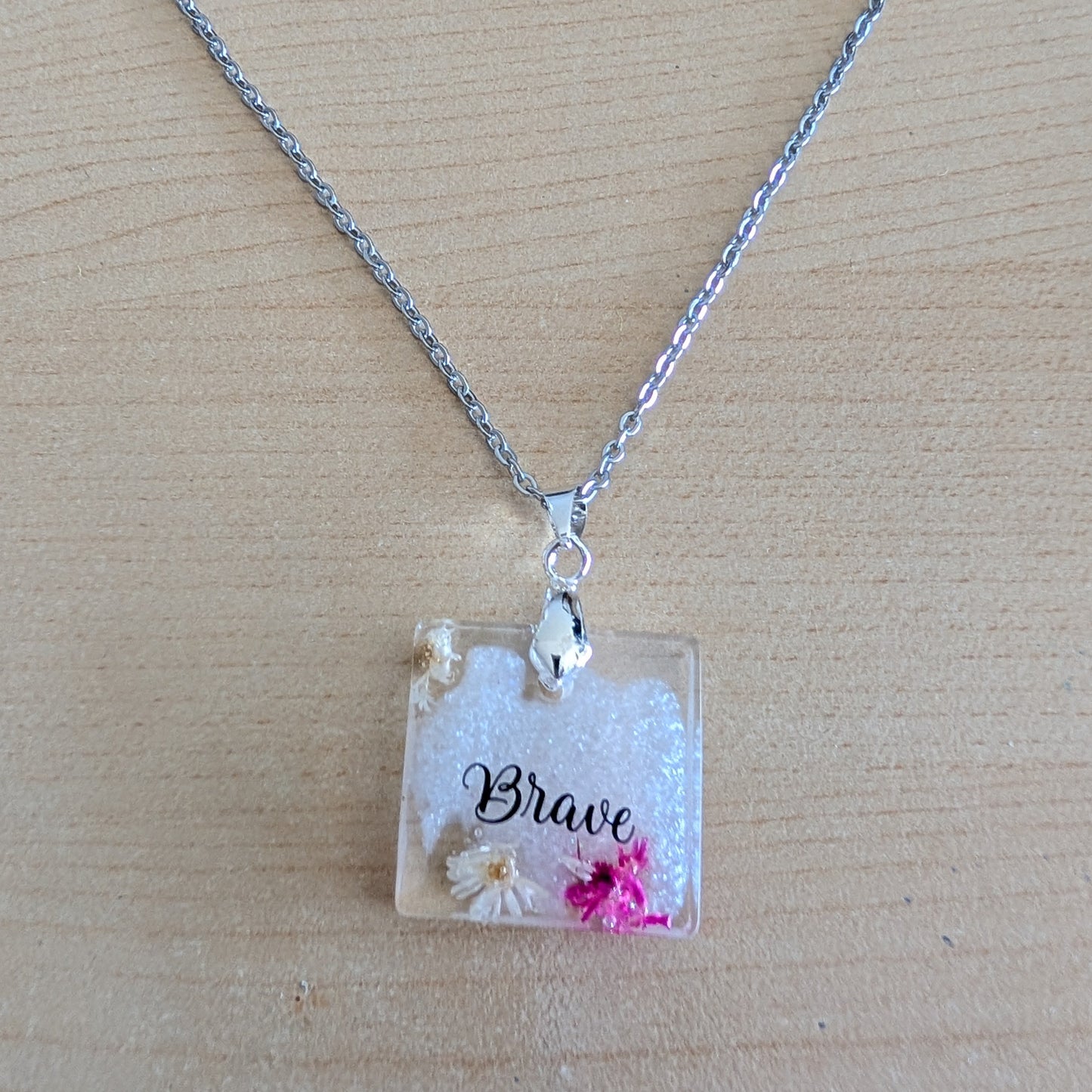Necklace - 21 inches stainless steel cable link chain with a resin with flowers square pendant