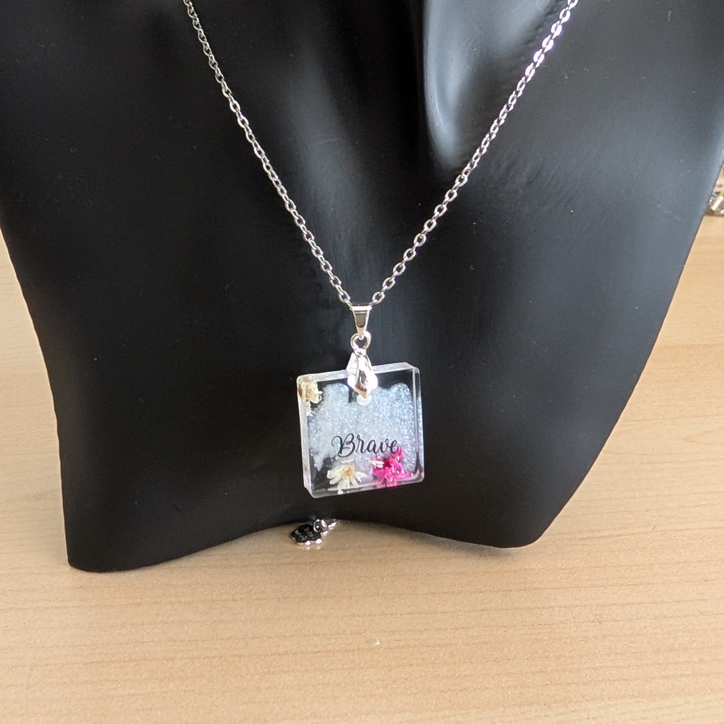 Necklace - 21 inches stainless steel cable link chain with a resin with flowers square pendant