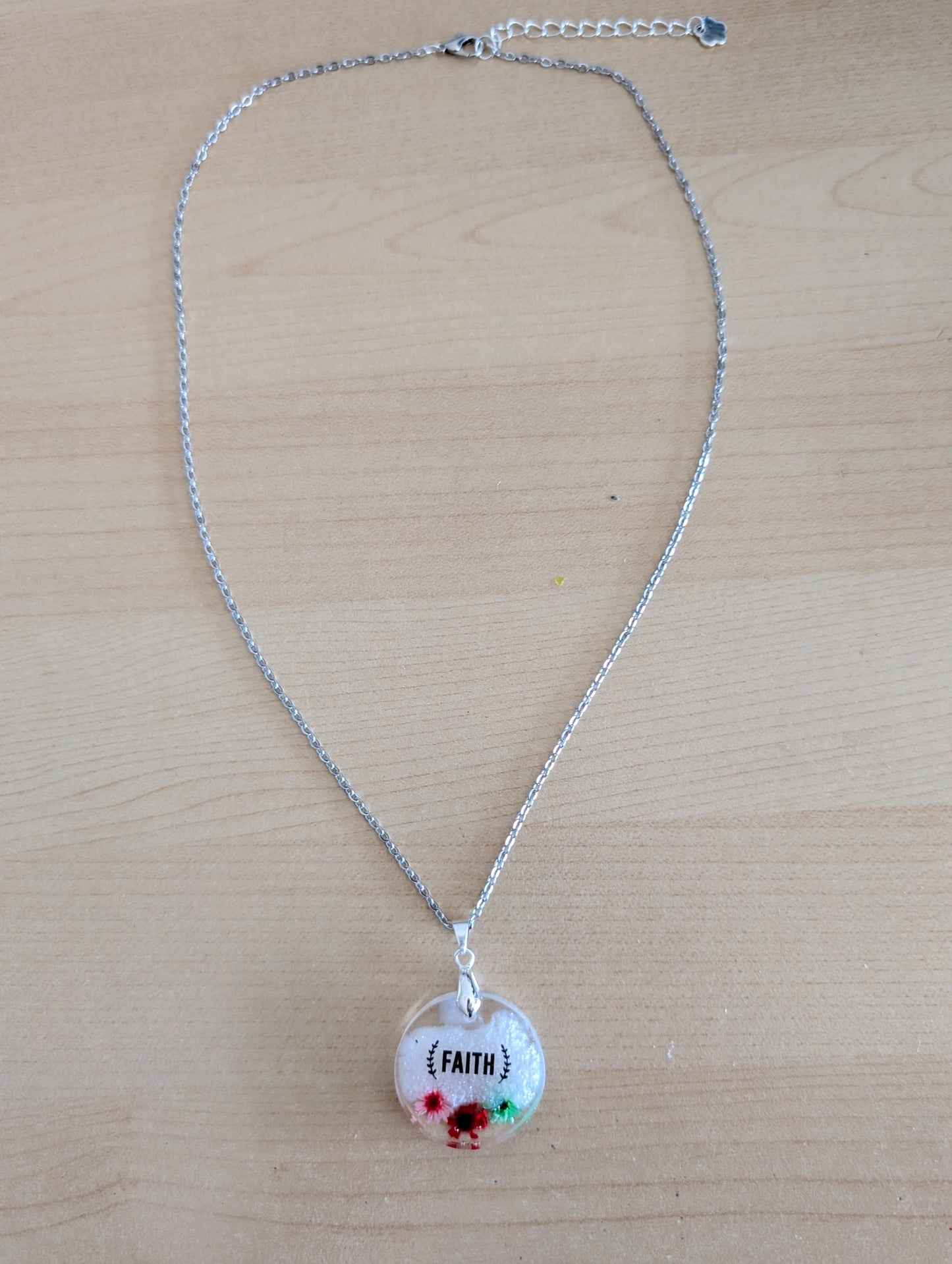 Necklace - 21 inches stainless steel cable link chain with a resin with flowers round pendant