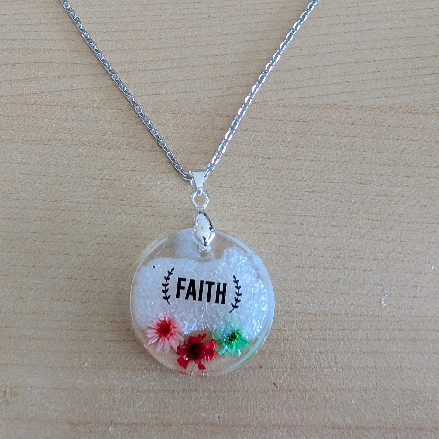 Necklace - 21 inches stainless steel cable link chain with a resin with flowers round pendant