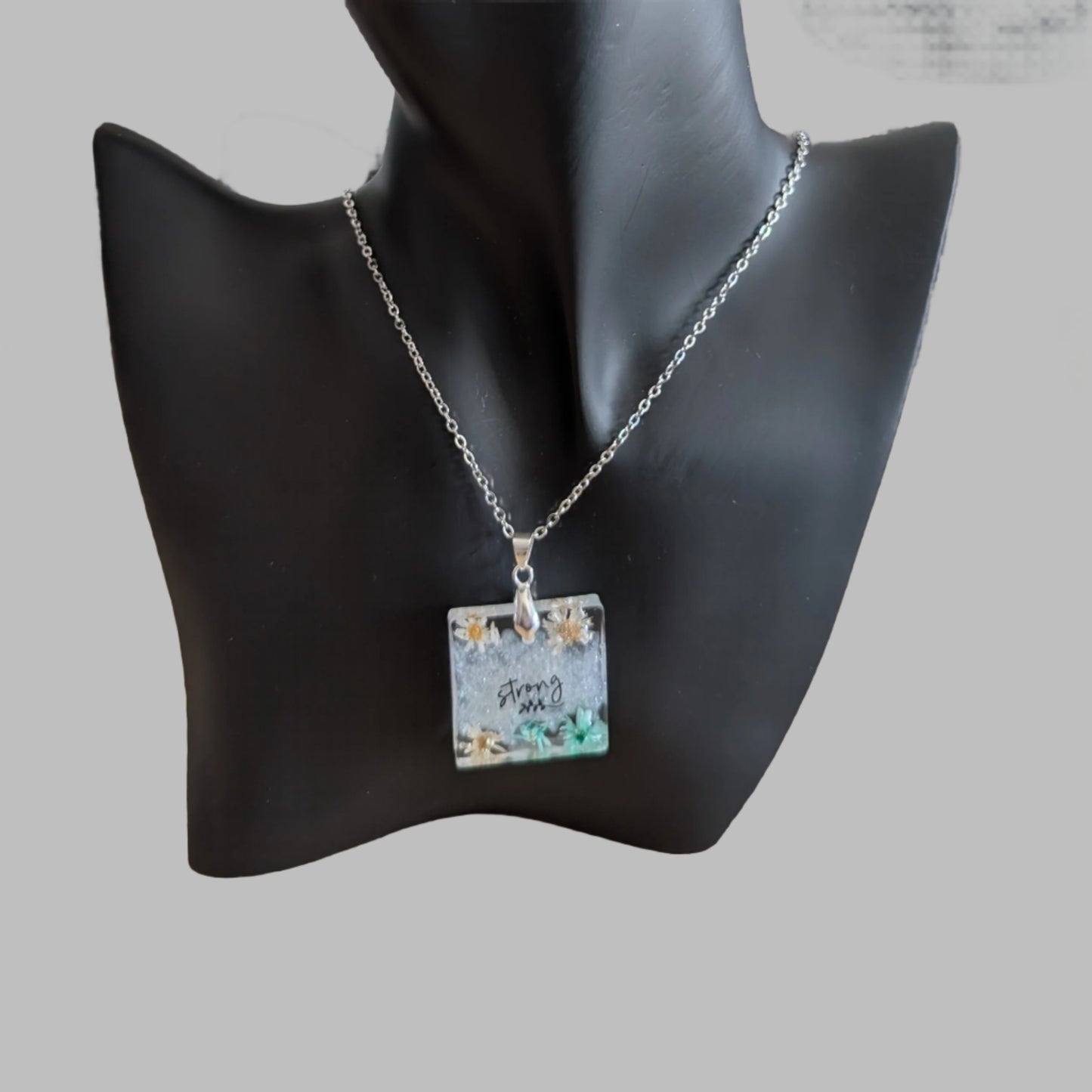 Necklace - 21 inches stainless steel cable link chain with a resin with flowers square pendant