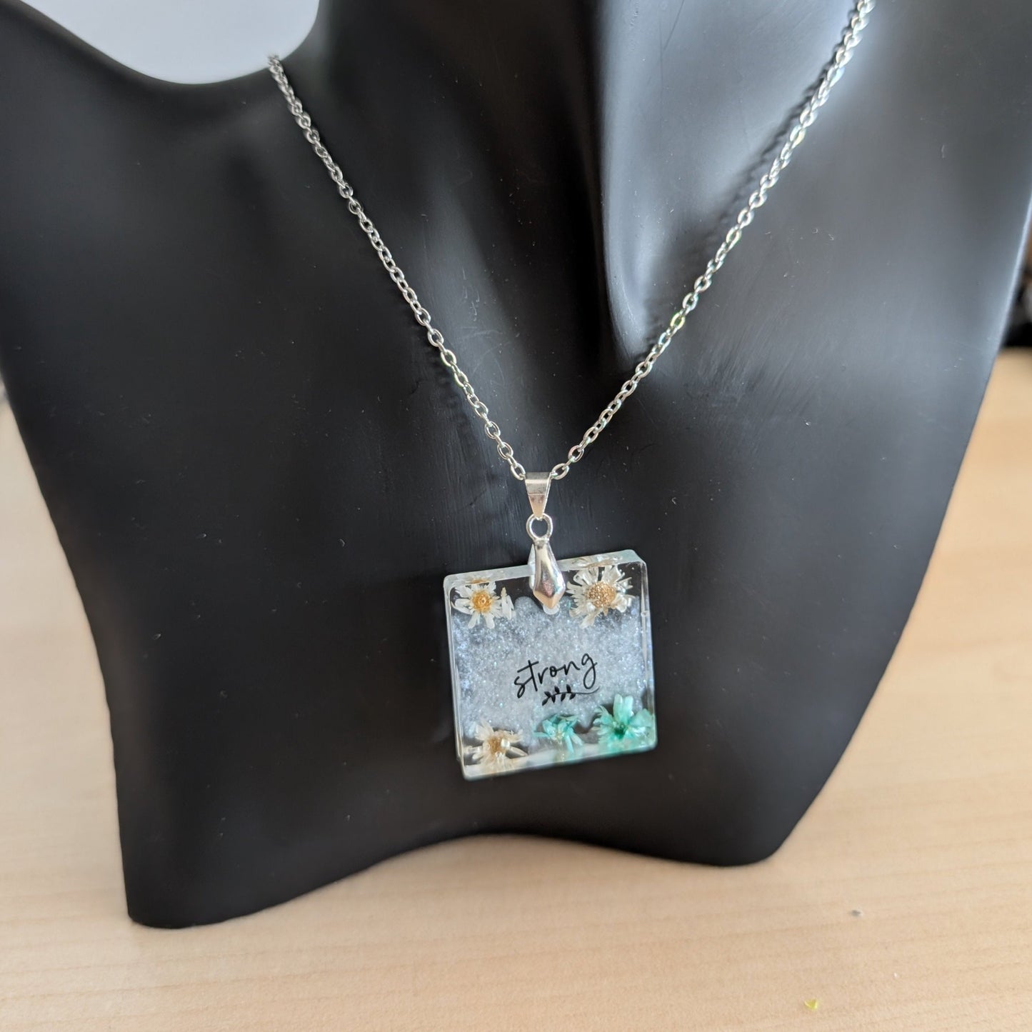 Necklace - 21 inches stainless steel cable link chain with a resin with flowers square pendant