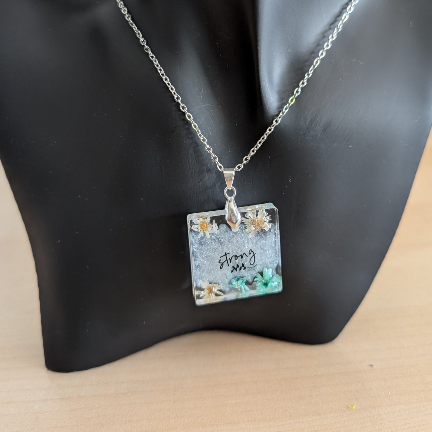 Necklace - 21 inches stainless steel cable link chain with a resin with flowers square pendant