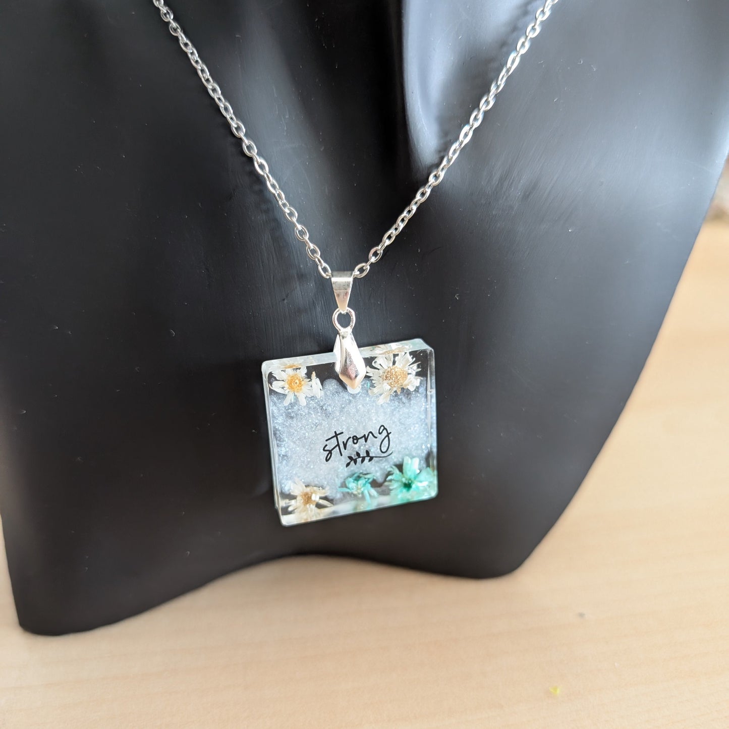 Necklace - 21 inches stainless steel cable link chain with a resin with flowers square pendant
