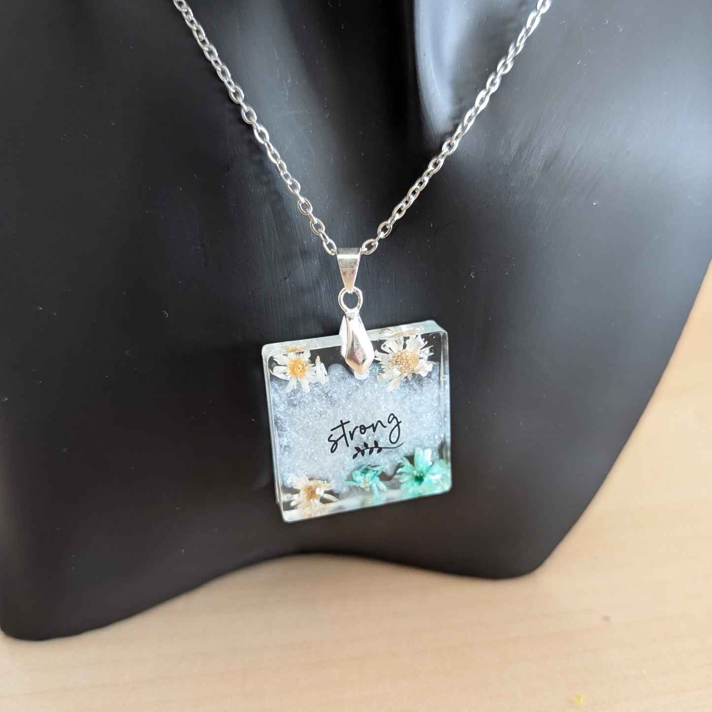 Necklace - 21 inches stainless steel cable link chain with a resin with flowers square pendant