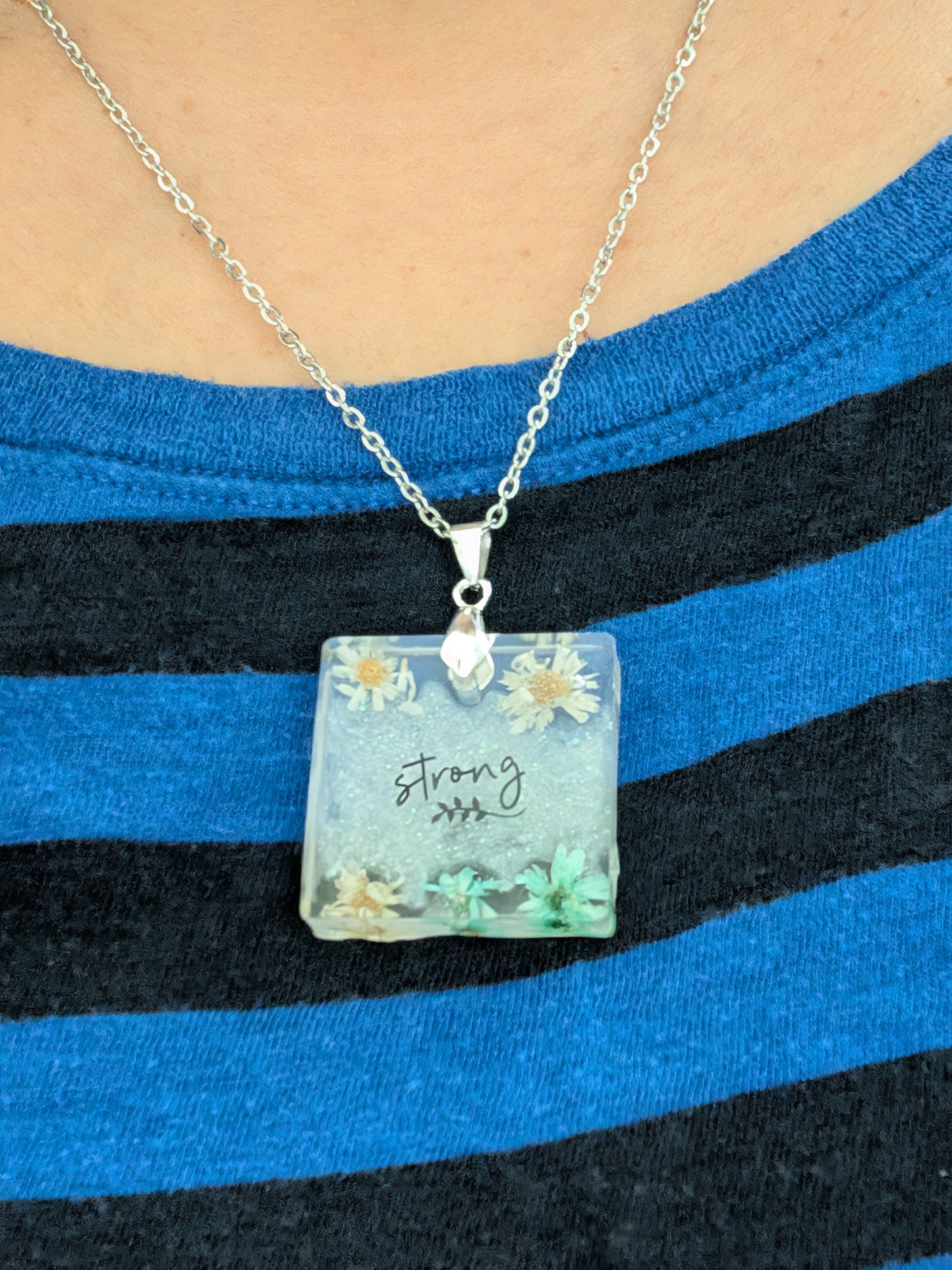 Necklace - 21 inches stainless steel cable link chain with a resin with flowers square pendant