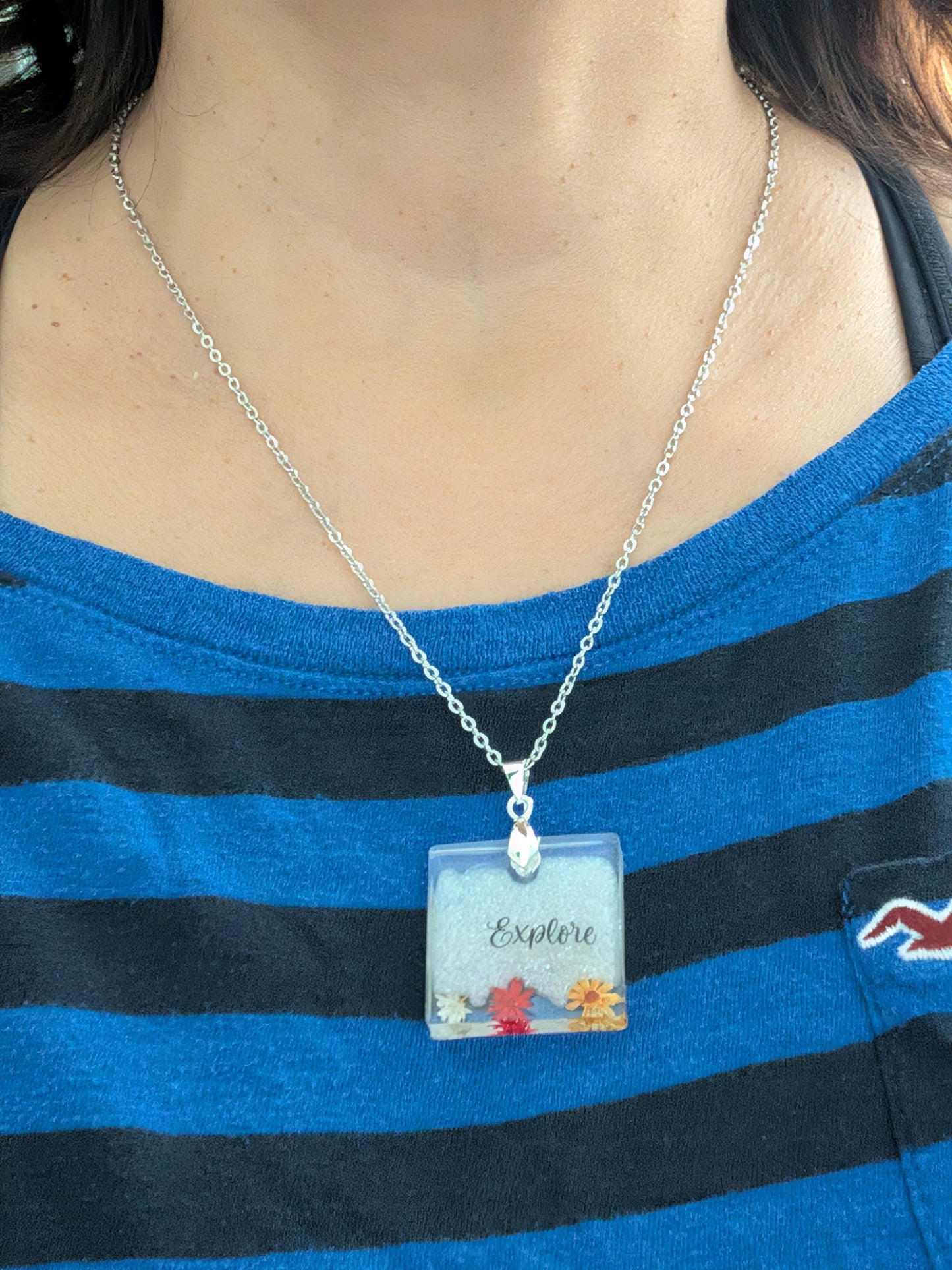 Necklace - 21 inches stainless steel cable link chain with a resin with flowers square pendant