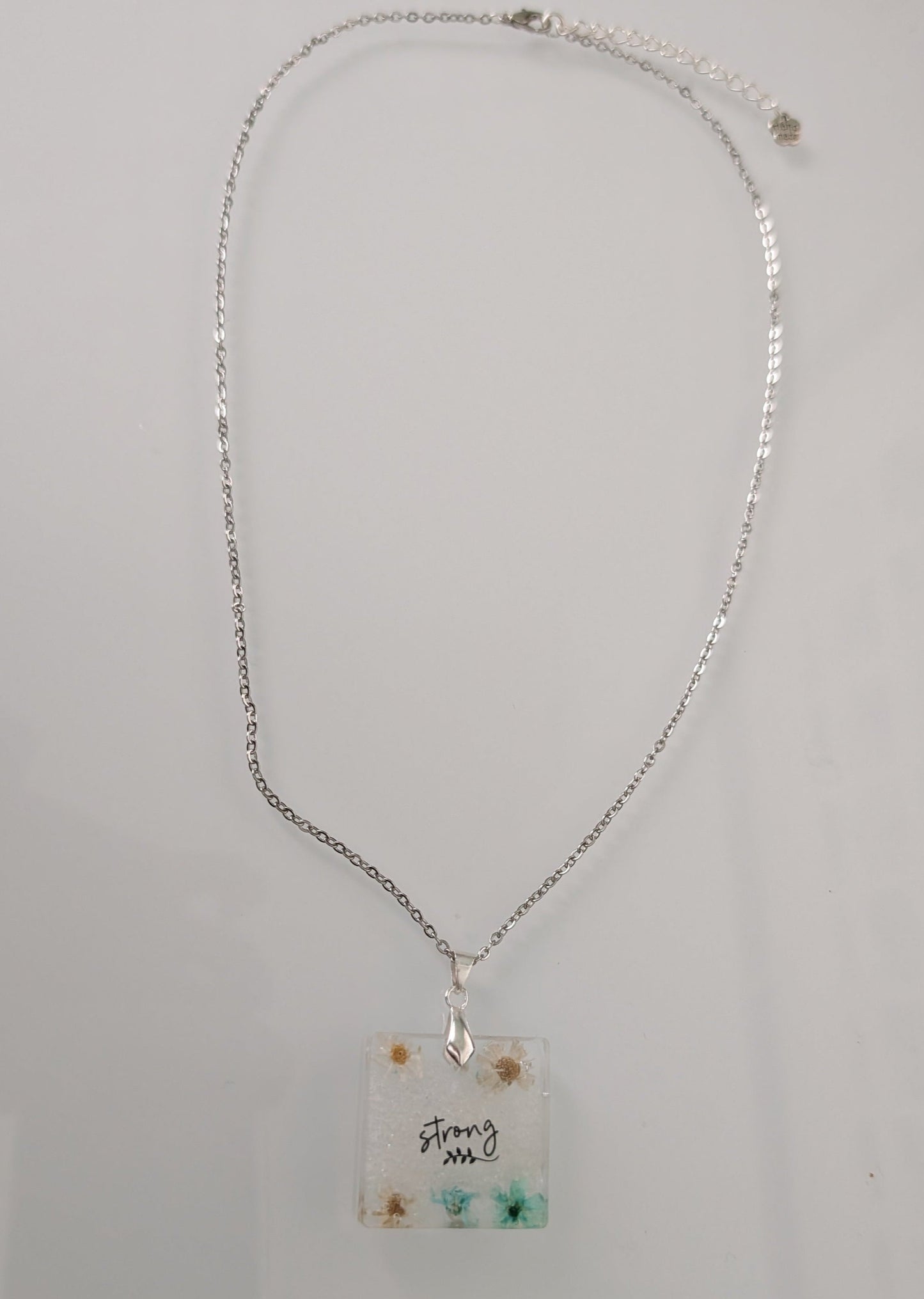 Necklace - 21 inches stainless steel cable link chain with a resin with flowers square pendant