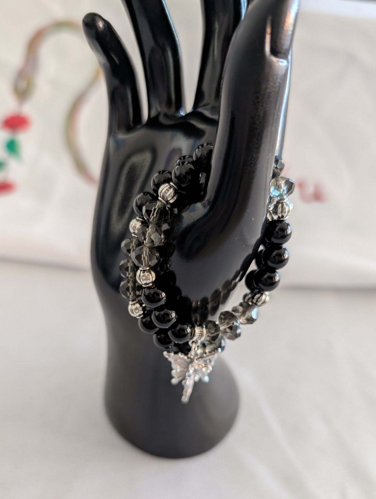 Bracelet - Elastic black beads with silver butterfly charm