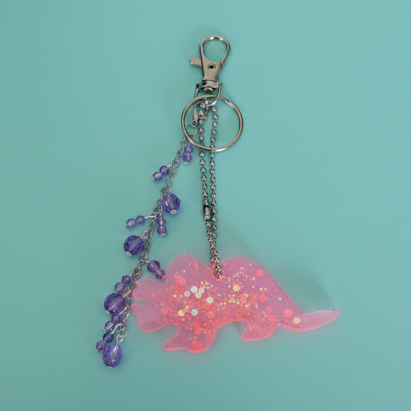 Triceratops Bag Charm – Handmade Resin Dinosaur Keychain with Beaded Tassel