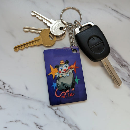Clown Opossum Keychain - Double-Sided Quirky Possum Bag Charm with Red Tassel | Whimsical Animal Gift