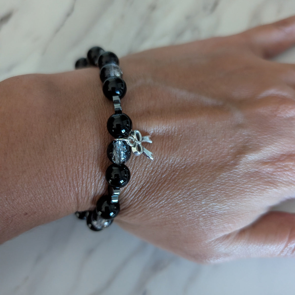 Black Crackle Glass Bead Stretch Bracelet with Silver Heart Accents & Bow Charm - Gothic Coquette Beaded Jewelry