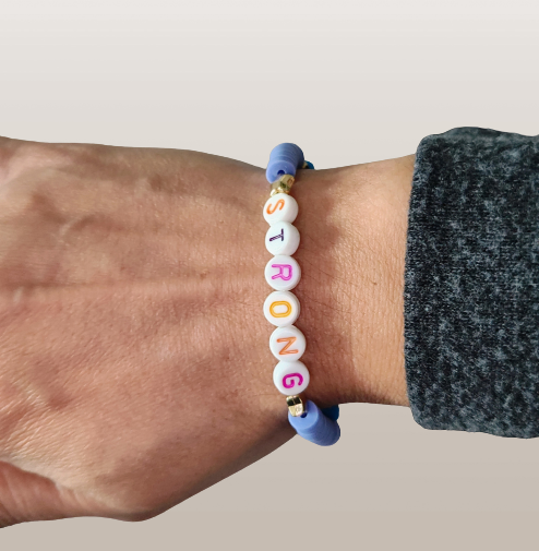 Bracelet - Medium 7.5 inches "Strong" elastic purple & blue clay beads with gold star spacer beads