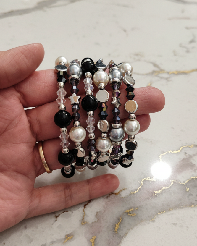 Bracelet - 6 coil black & silver glass beads with white pearl beads and clear, purple, black bicone beads with silver spacer beads memory wire bracelet