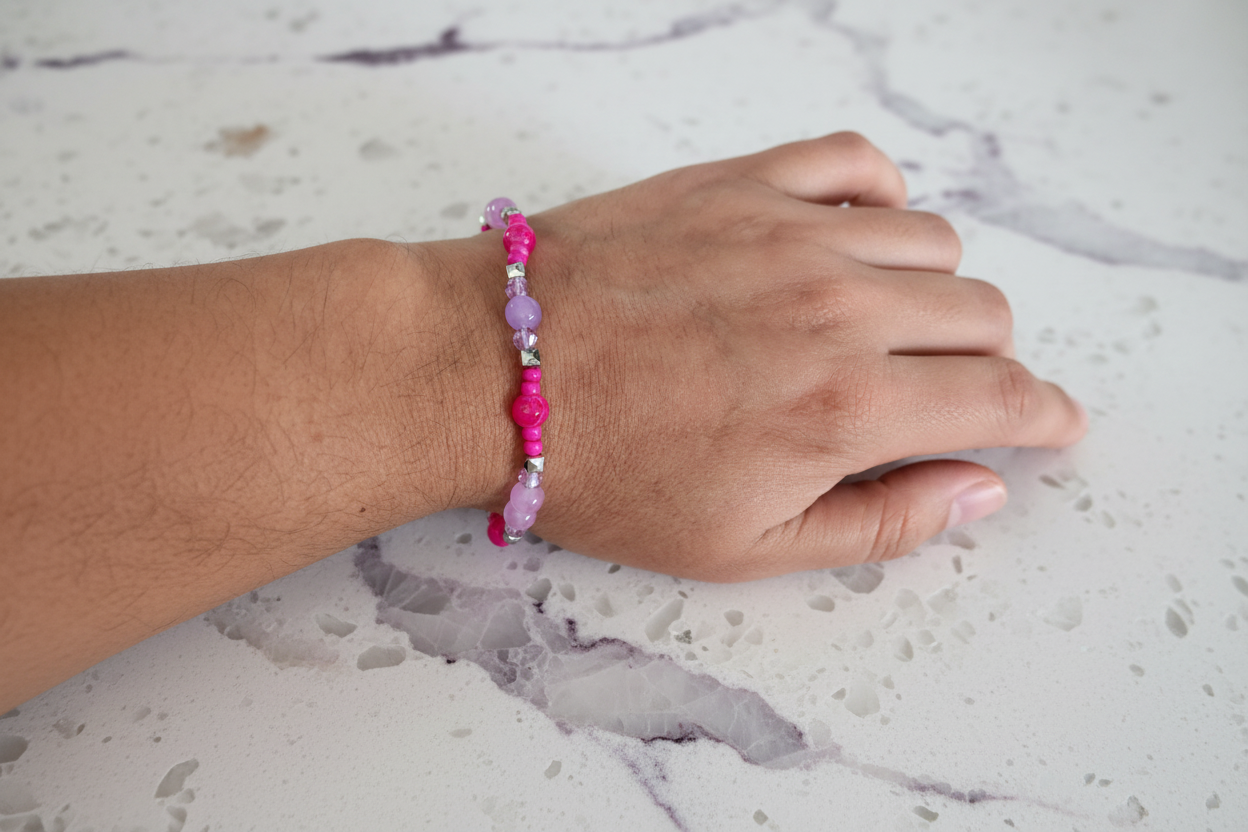 Bracelet - Medium 7.5 inches Elastic hot pink & light pink 6mm glass beads and 4mm bicone beads and seed beads with silver spacer beads