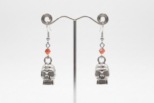 Earrings - Small hollowed eyes skull with bead on hook
