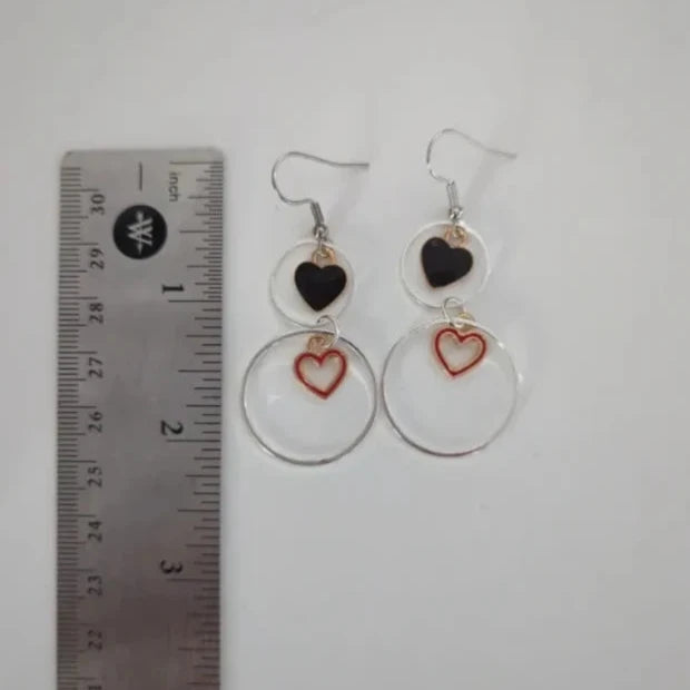 Earrings - One 1 inch silver circle and One 1/2 inch silver circle with 1 solid gold plated heart and 1 hollow gold plated heart on silver hook