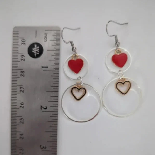 Earrings - Two 1 inch silver circles with 1 solid gold plated heart and 1 hollow gold plated heart on silver hook