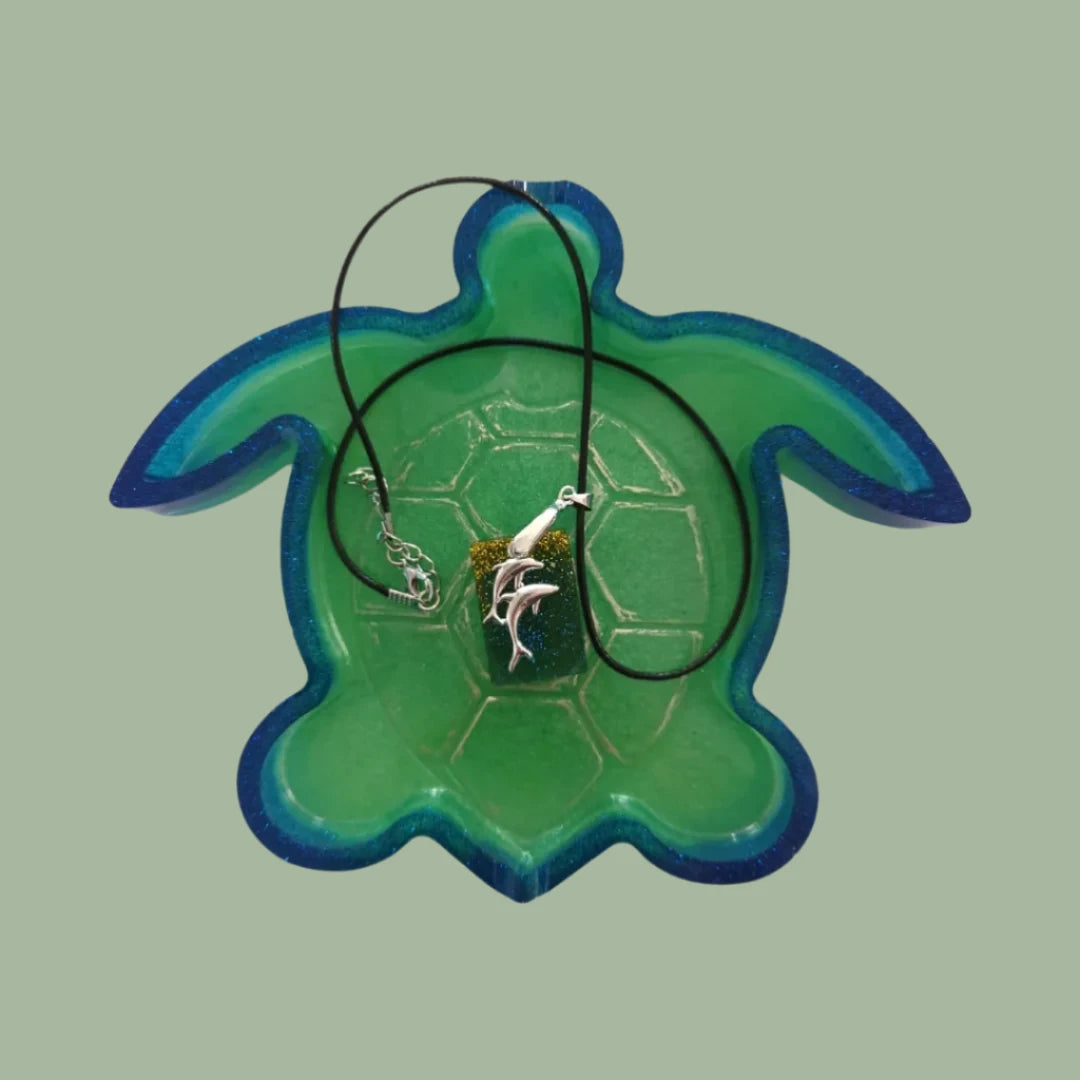 Necklace - 18 inches resin rectangle with dolphins silver charm on black cord