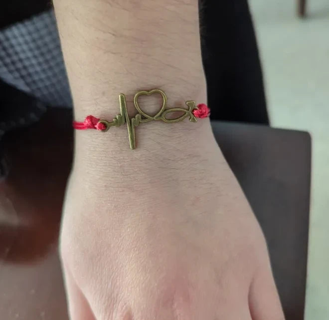 Bracelet - Adjustable antique bronze heart beat on waxed polyester cord Bracelet