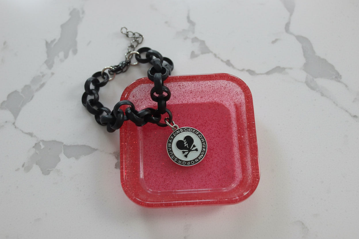 Bracelet - 7 inches Broken heart charm on black rolo chain