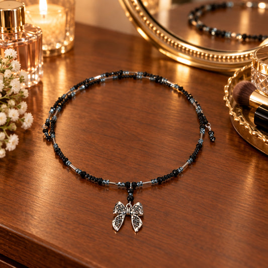 Black Crystal & Silver Tube Bead Memory Wire Choker – Textured Bow Charm