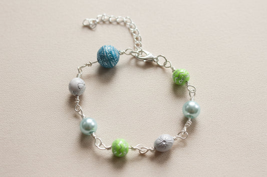 Bracelet - 7 inches blue, green, and white beads with silver lobster clasp